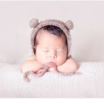 newborn head on hands pose
