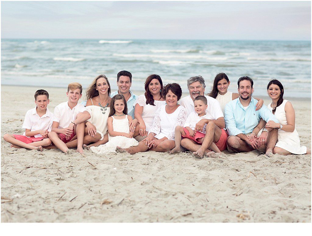large family posing beach