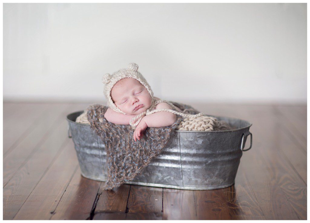 newborn in galvanized bucket