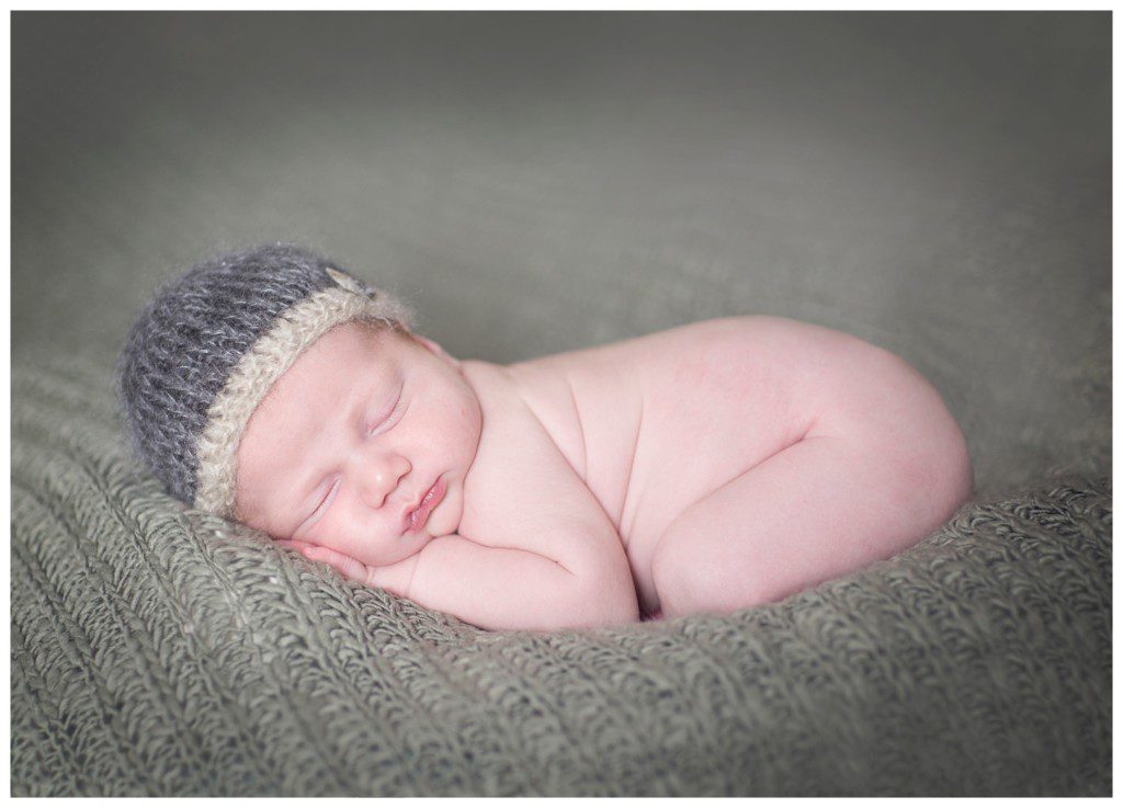 baby on blanket newborn pose