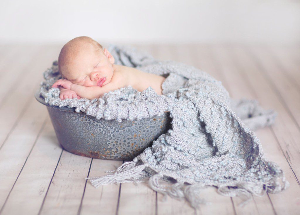 baby in a bucket newborn picture
