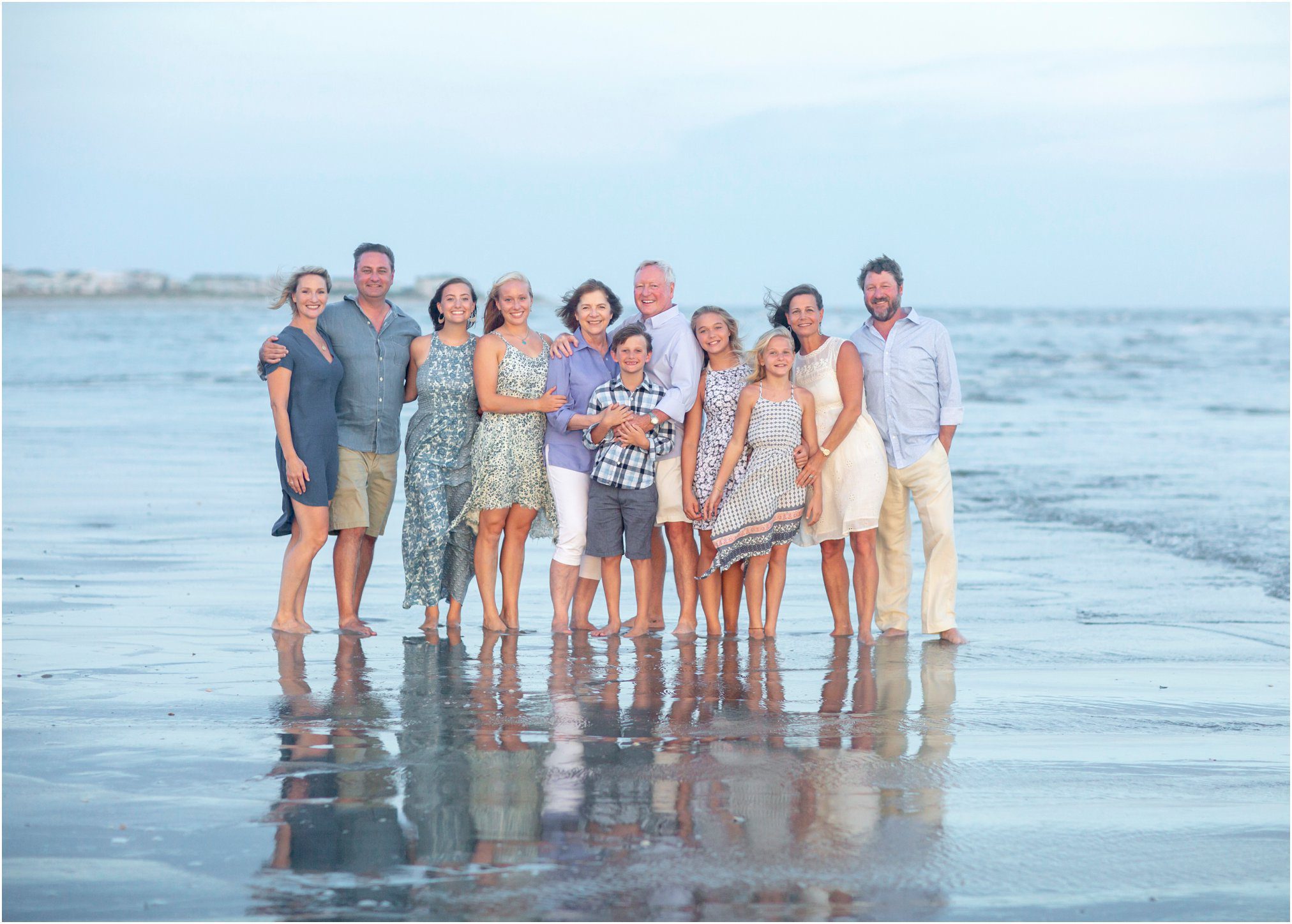 large family pose at the beach
